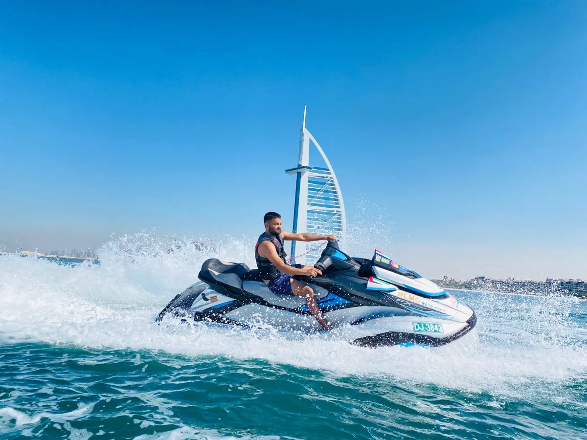 Guest riding a jet ski in front of the Burj Al Arab