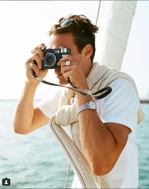 Photographer shooting guests on deck during a charter