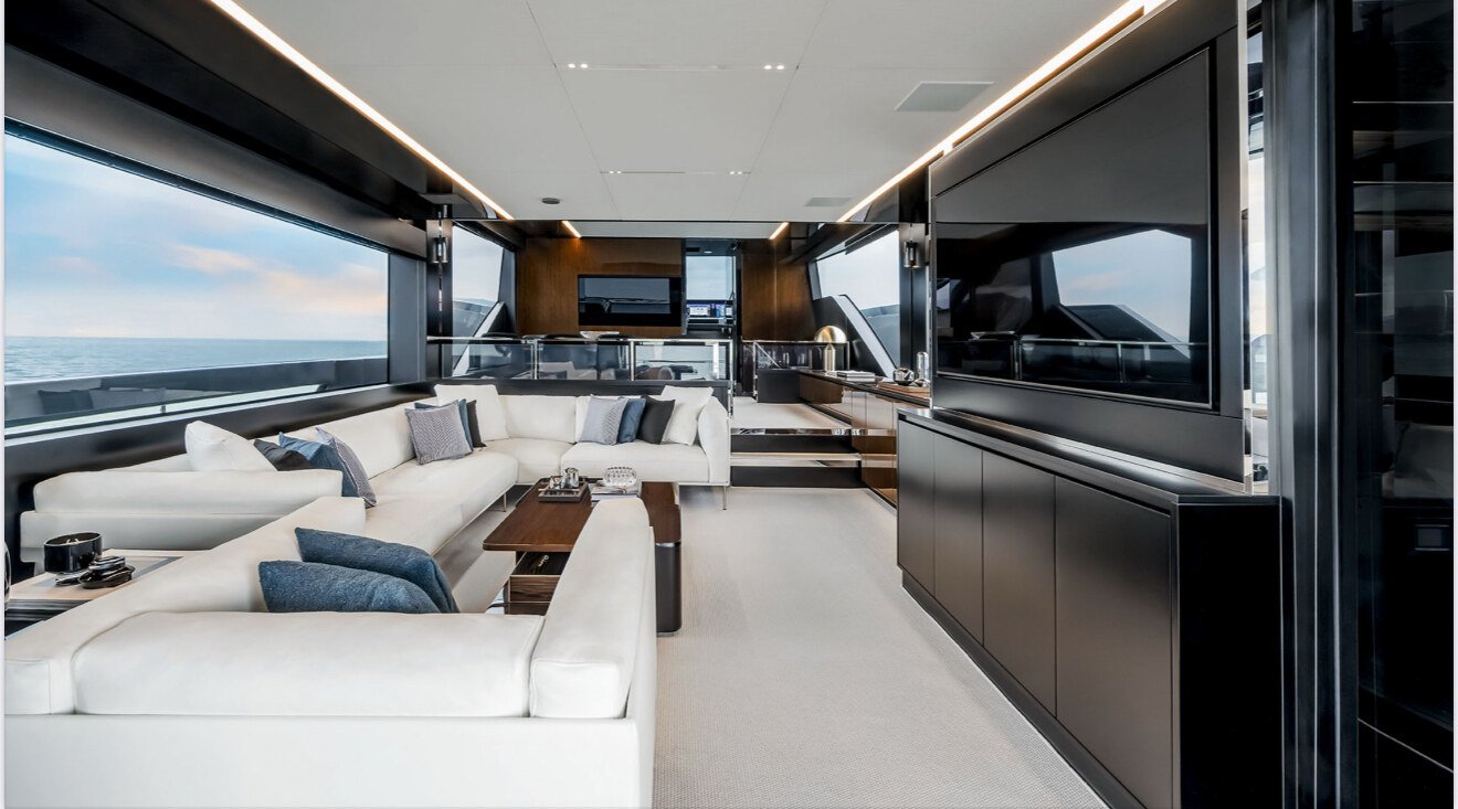 Interior salon of the Riva 82 with cream sofas and wood panelling